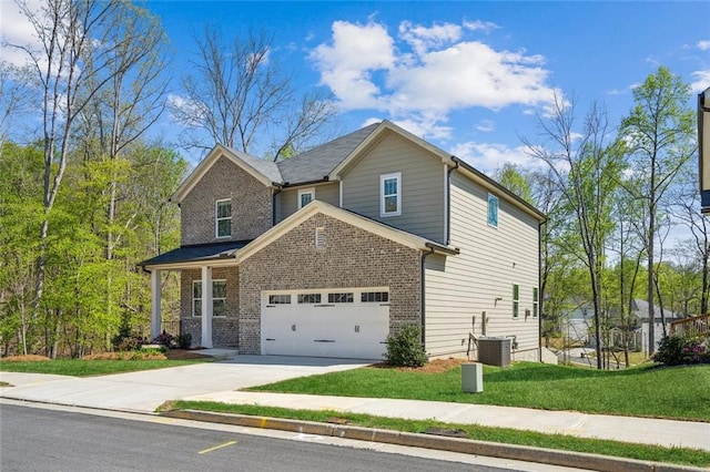164 Long Leaf St, Dawsonville, GA 30534 - view of property exterior with brick siding, a lawn, a garage, and concrete driveway