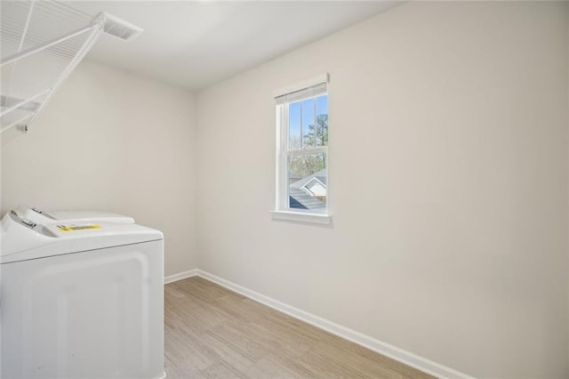 164 Long Leaf St, Dawsonville, GA 30534 - laundry area with baseboards, light wood finished floors, and laundry area