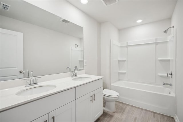 164 Long Leaf St, Dawsonville, GA 30534 - bathroom featuring visible vents, a sink, and toilet