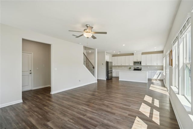 164 Long Leaf St, Dawsonville, GA 30534 - unfurnished living room with dark wood-style flooring, baseboards, recessed lighting, stairway, and a ceiling fan