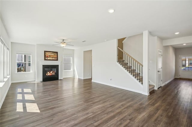 164 Long Leaf St, Dawsonville, GA 30534 - unfurnished living room with baseboards, dark wood-style flooring, ceiling fan, recessed lighting, and stairway