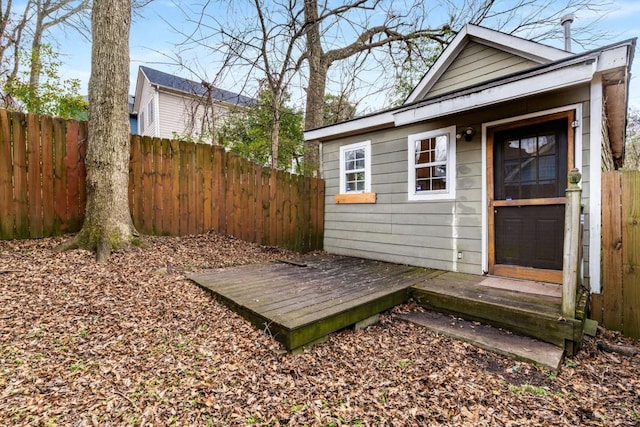 property entrance featuring a wooden deck