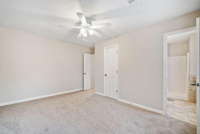 unfurnished bedroom featuring ceiling fan, carpet flooring, visible vents, and baseboards