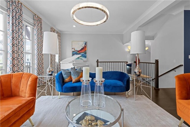 living area featuring recessed lighting, an upstairs landing, and wood finished floors