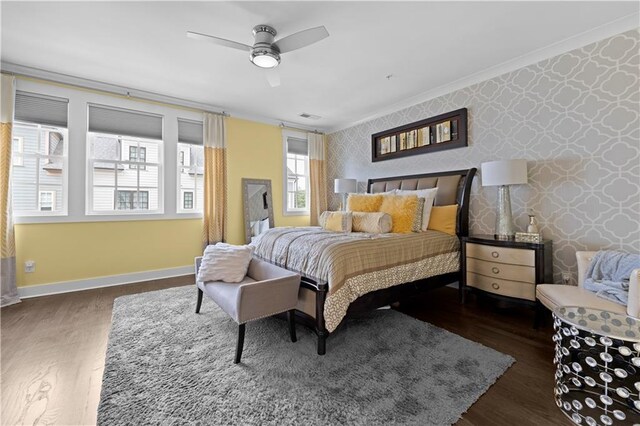 bedroom featuring wallpapered walls, crown molding, baseboards, and dark wood-style flooring