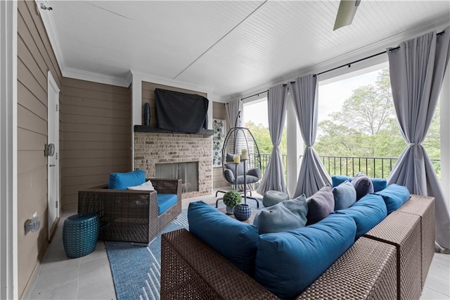 sunroom featuring a fireplace