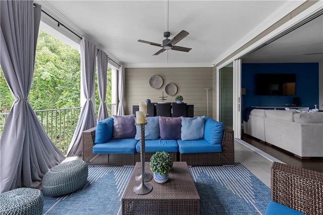 sunroom featuring ceiling fan