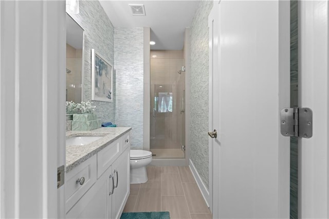 full bath with visible vents, toilet, tile patterned floors, vanity, and a shower stall