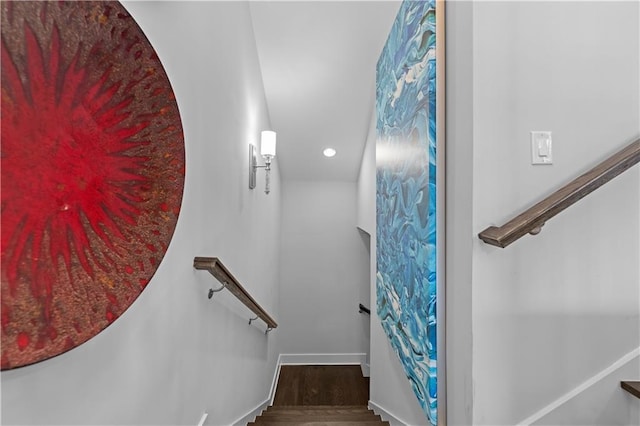 staircase featuring recessed lighting, baseboards, and wood finished floors