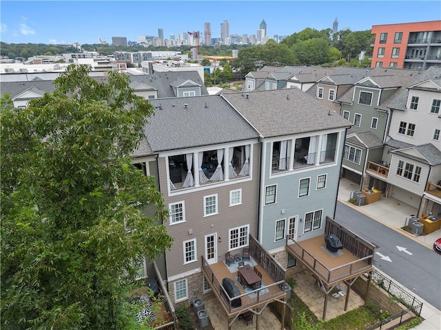 birds eye view of property with a view of city