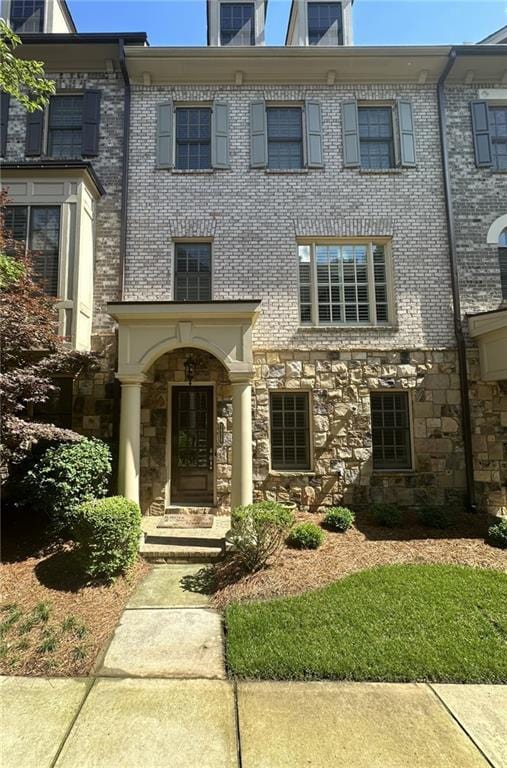 view of front of house with stone siding