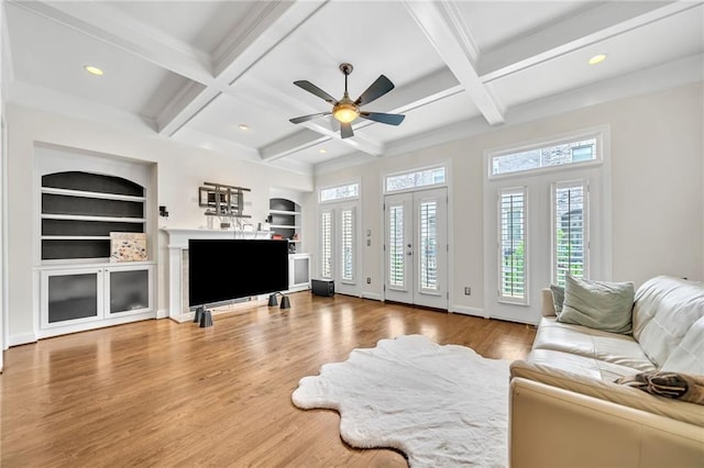 living room featuring recessed lighting, coffered ceiling, wood finished floors, beamed ceiling, and ceiling fan