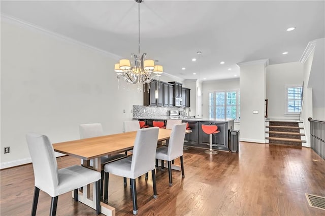 dining space featuring ornamental molding, a chandelier, visible vents, and recessed lighting