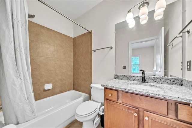 bathroom with shower / tub combo, vanity, and toilet