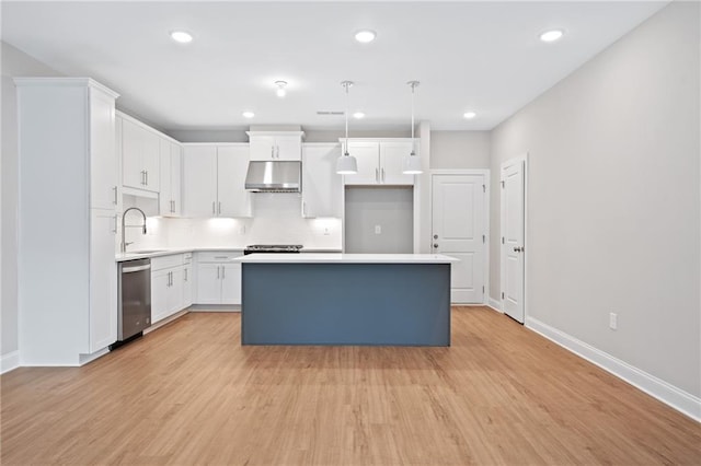 kitchen featuring light hardwood / wood-style flooring, decorative light fixtures, white cabinetry, dishwasher, and a kitchen island