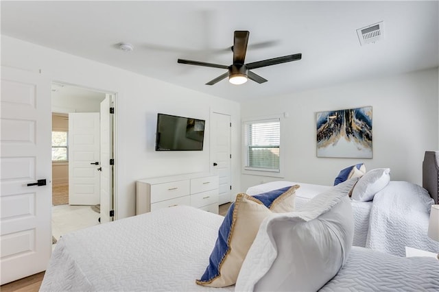 bedroom featuring light hardwood / wood-style floors and ceiling fan