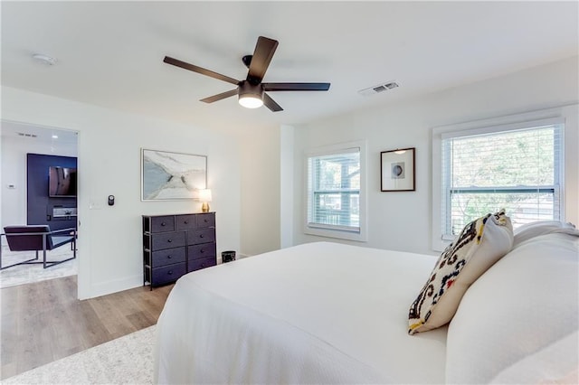 bedroom featuring ceiling fan and light hardwood / wood-style floors