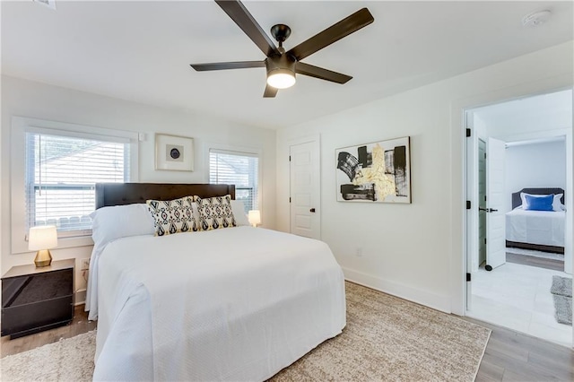 bedroom featuring light hardwood / wood-style floors and ceiling fan