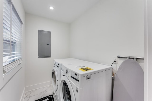 washroom with electric panel and separate washer and dryer