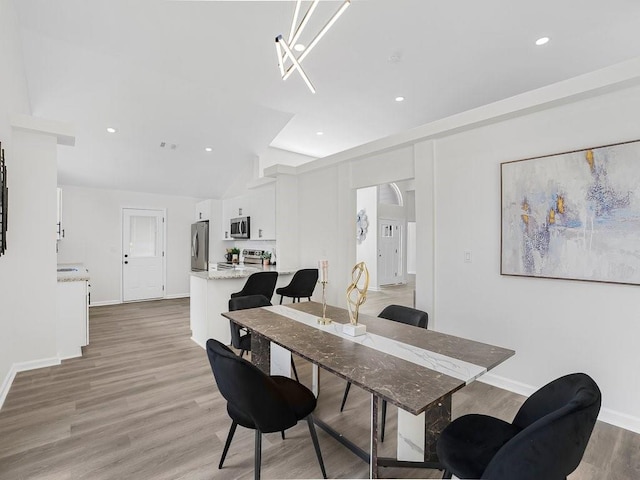 3100 Mount Gilead Rd SW, Atlanta, GA 30311 - dining area featuring light wood-style flooring, recessed lighting, and lofted ceiling