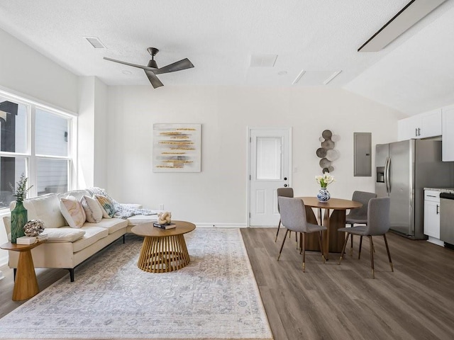 3100 Mount Gilead Rd SW, Atlanta, GA 30311 - living area featuring electric panel, wood finished floors, vaulted ceiling, and a ceiling fan
