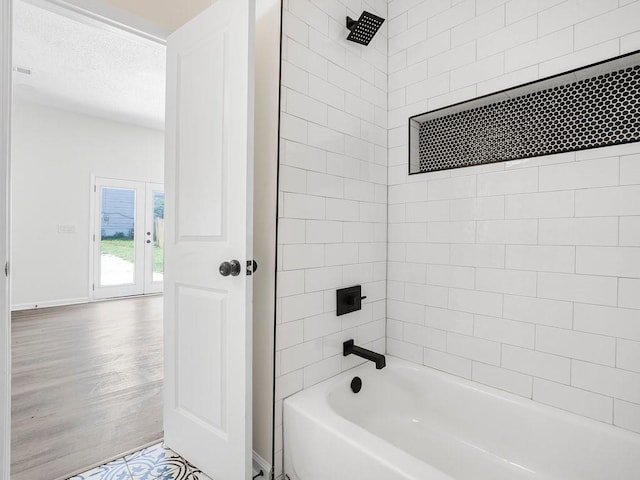 3100 Mount Gilead Rd SW, Atlanta, GA 30311 - full bath featuring bathtub / shower combination, a textured ceiling, and wood finished floors