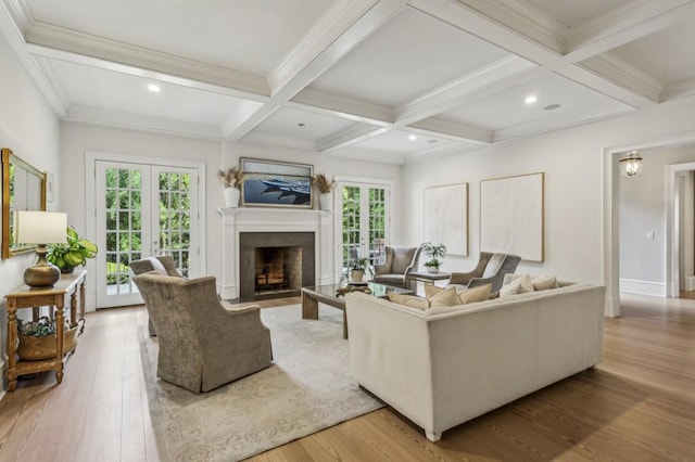 2671 Bohler Rd NW, Atlanta, GA 30327 - living room with a fireplace with flush hearth, beamed ceiling, coffered ceiling, light wood finished floors, and recessed lighting
