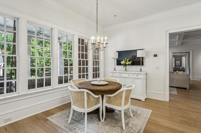 2671 Bohler Rd NW, Atlanta, GA 30327 - dining space featuring a chandelier, ornamental molding, and light wood-type flooring
