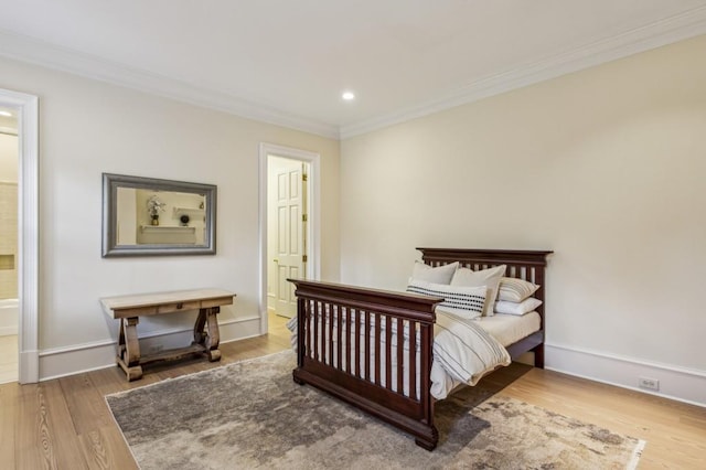 2671 Bohler Rd NW, Atlanta, GA 30327 - bedroom featuring ornamental molding, wood finished floors, recessed lighting, and ensuite bathroom