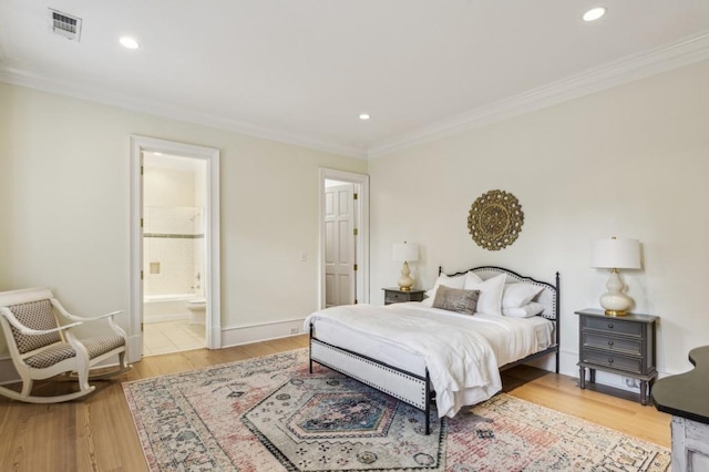 2671 Bohler Rd NW, Atlanta, GA 30327 - bedroom with crown molding, light wood finished floors, recessed lighting, and connected bathroom
