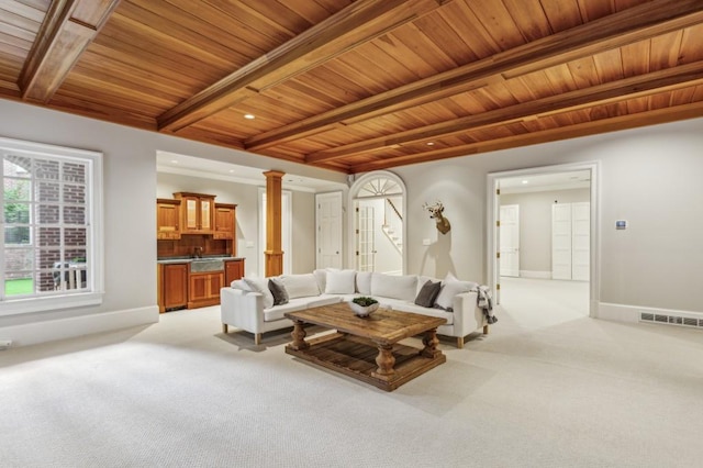 2671 Bohler Rd NW, Atlanta, GA 30327 - living area with a wood ceiling with exposed beams, light carpet, ornate columns, and recessed lighting