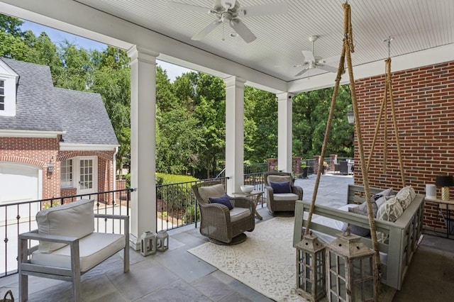 2671 Bohler Rd NW, Atlanta, GA 30327 - view of patio with an outdoor living space, ceiling fan, and view of scattered trees