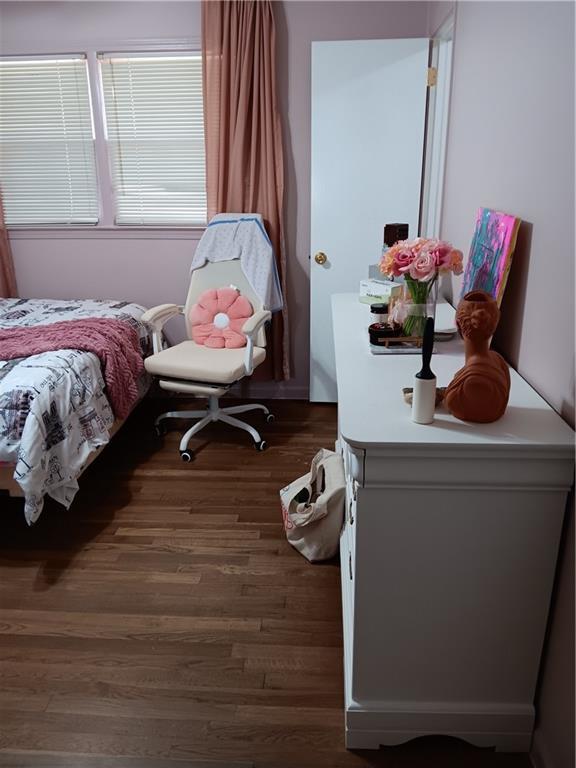 bedroom featuring dark hardwood / wood-style flooring