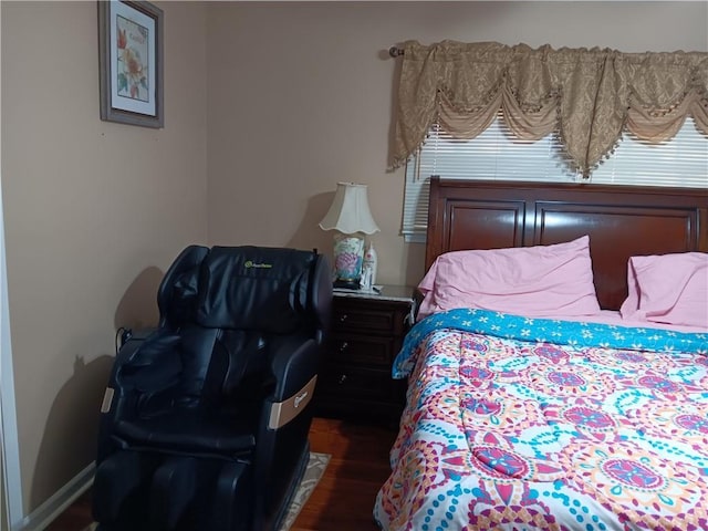 bedroom featuring dark hardwood / wood-style flooring