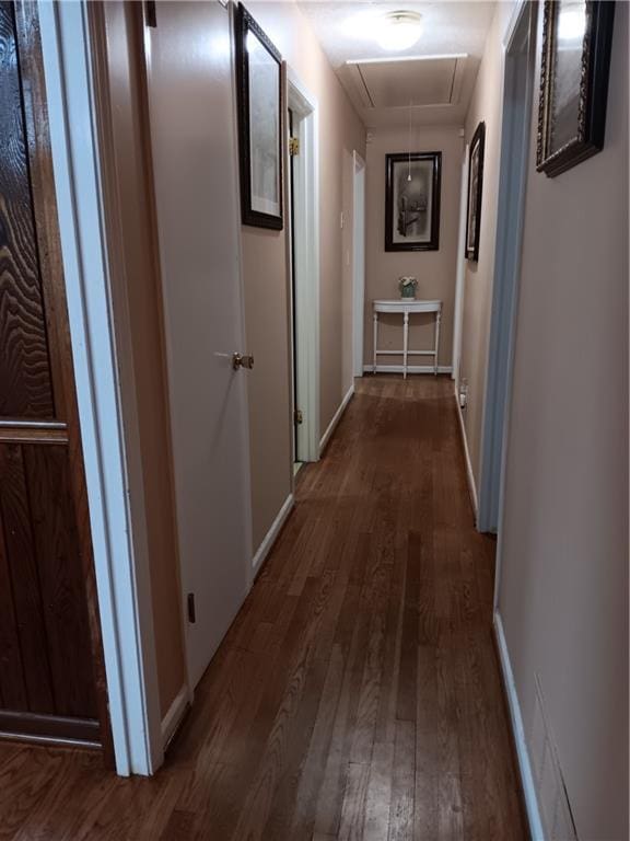 2479 Kingsland Dr, Dunwoody, GA 30360 - hallway featuring attic access, wood finished floors, and baseboards