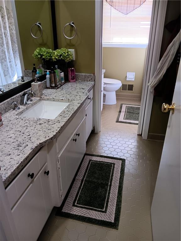 2479 Kingsland Dr, Dunwoody, GA 30360 - bathroom with toilet and vanity