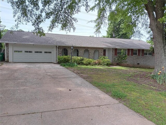 2479 Kingsland Dr, Dunwoody, GA 30360 - single story home featuring driveway, a garage, brick siding, and roof with shingles