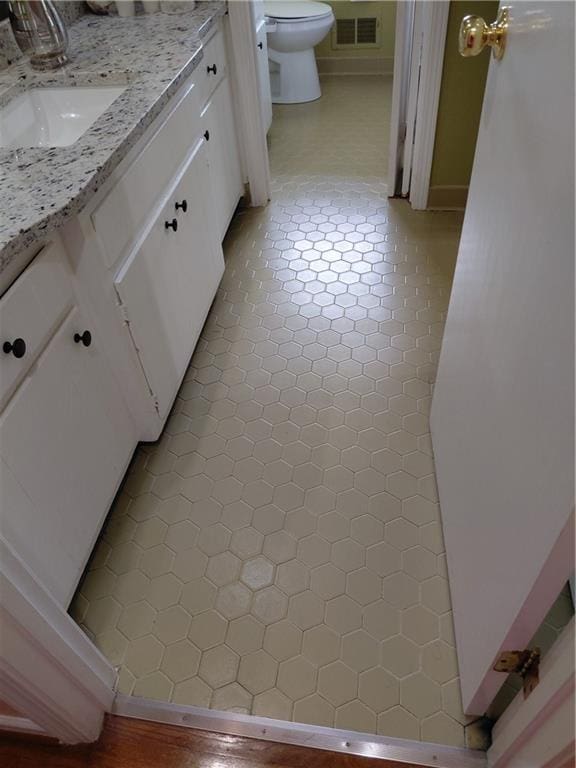 2479 Kingsland Dr, Dunwoody, GA 30360 - bathroom featuring toilet, vanity, and tile patterned floors
