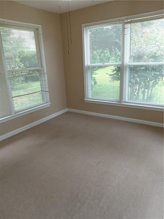 2479 Kingsland Dr, Dunwoody, GA 30360 - carpeted spare room featuring baseboards