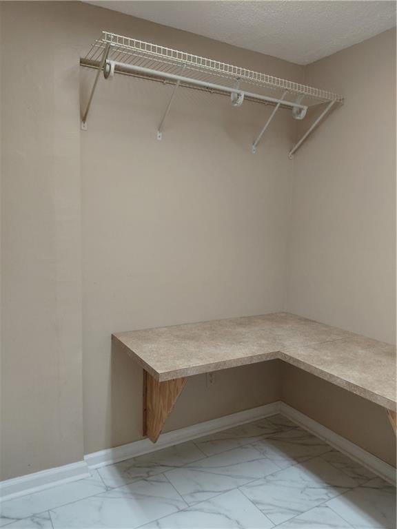 2479 Kingsland Dr, Dunwoody, GA 30360 - walk in closet with light marble finish floors