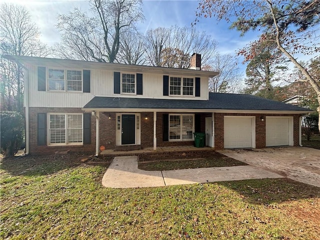 front facade featuring covered porch, a garage, and a front yard