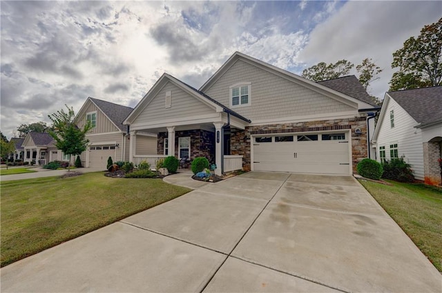 craftsman-style home with a front lawn, a garage, and a porch