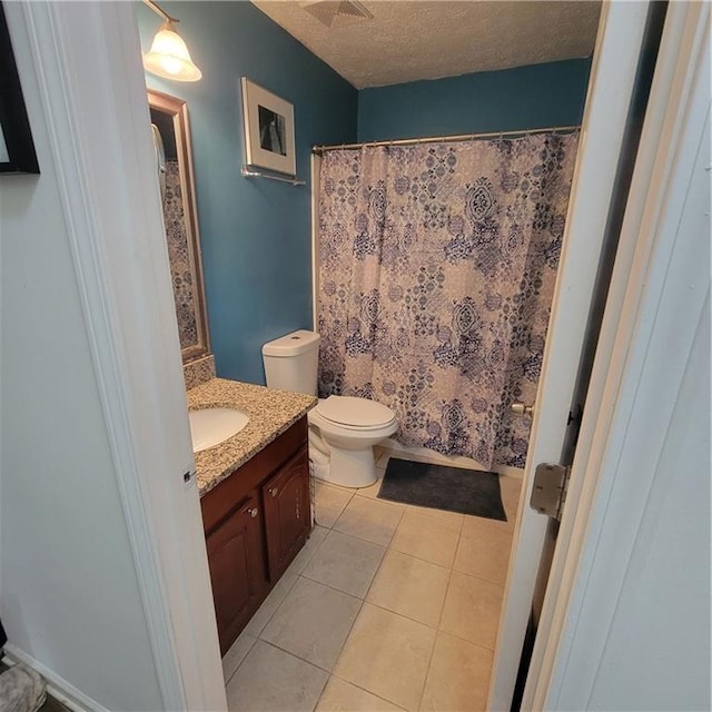 full bath with tile patterned floors, toilet, a textured ceiling, a shower with shower curtain, and vanity