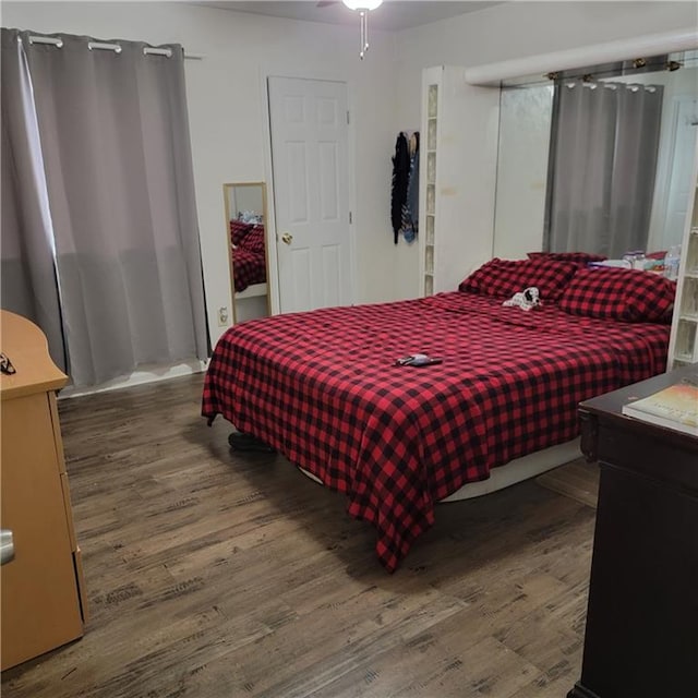 bedroom with wood finished floors