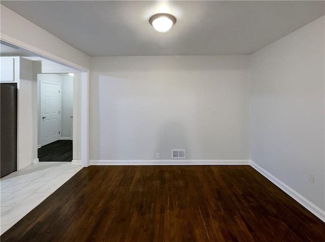 unfurnished room featuring hardwood / wood-style floors