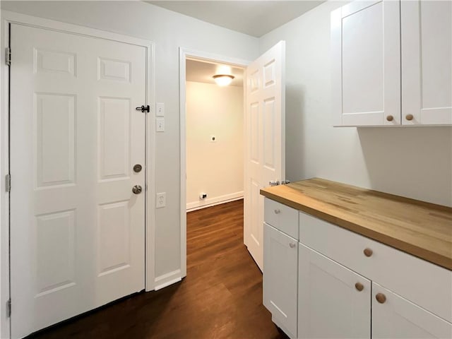 hallway with dark hardwood / wood-style floors