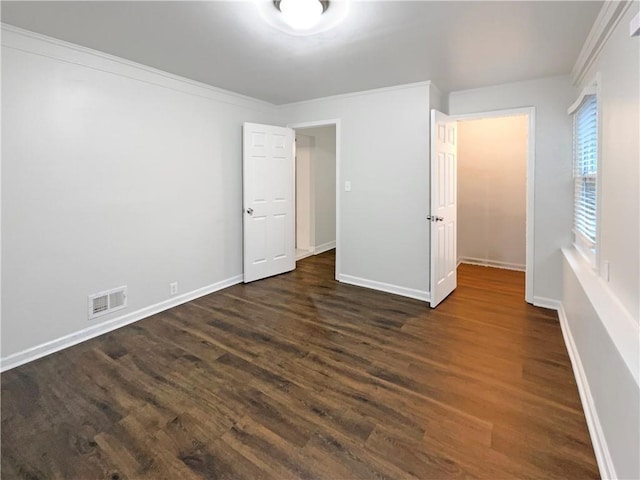 unfurnished bedroom with dark hardwood / wood-style floors