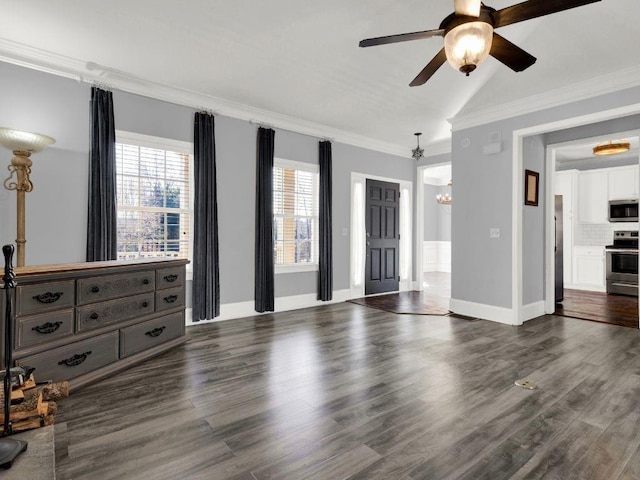 unfurnished living room featuring dark wood-style flooring, baseboards, ceiling fan with notable chandelier, lofted ceiling, and ornamental molding