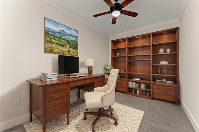 office area featuring ceiling fan, baseboards, crown molding, and carpet flooring
