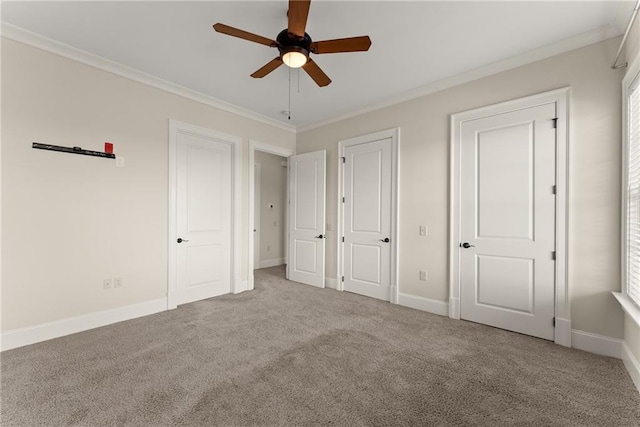 unfurnished bedroom featuring crown molding, ceiling fan, and light carpet